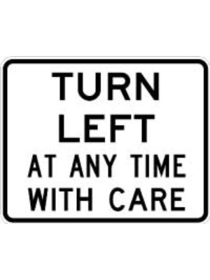 Turn Left At Any Time With Care Sign